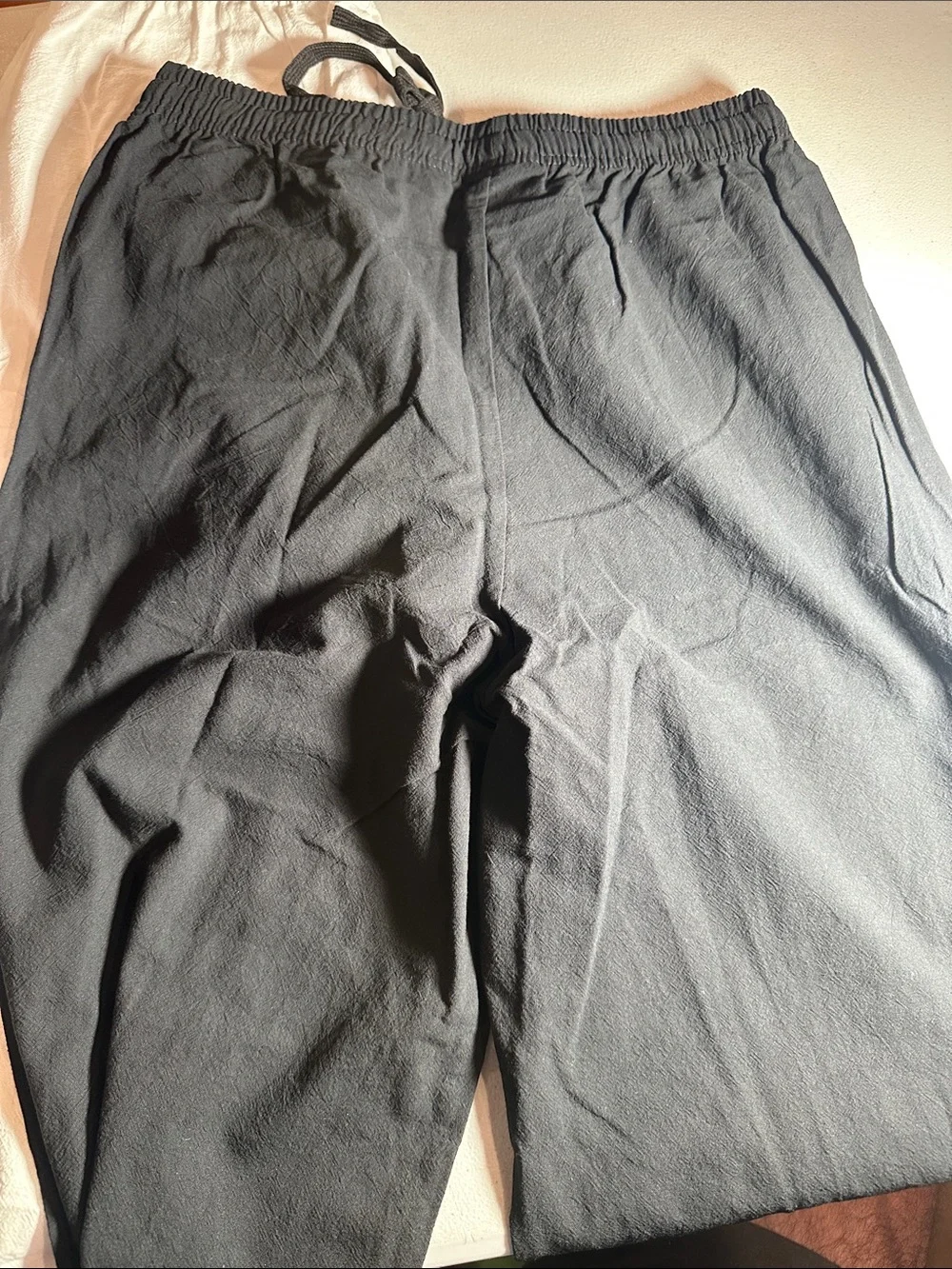 2 pack of Women's lightweight pants. One white and one black pair of medium pant